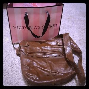 Victoria Secret lotion and a leather purse.